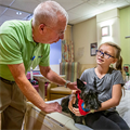 Deacon’s love for dogs translates into smiles for pediatric patients at Mercy Hospital