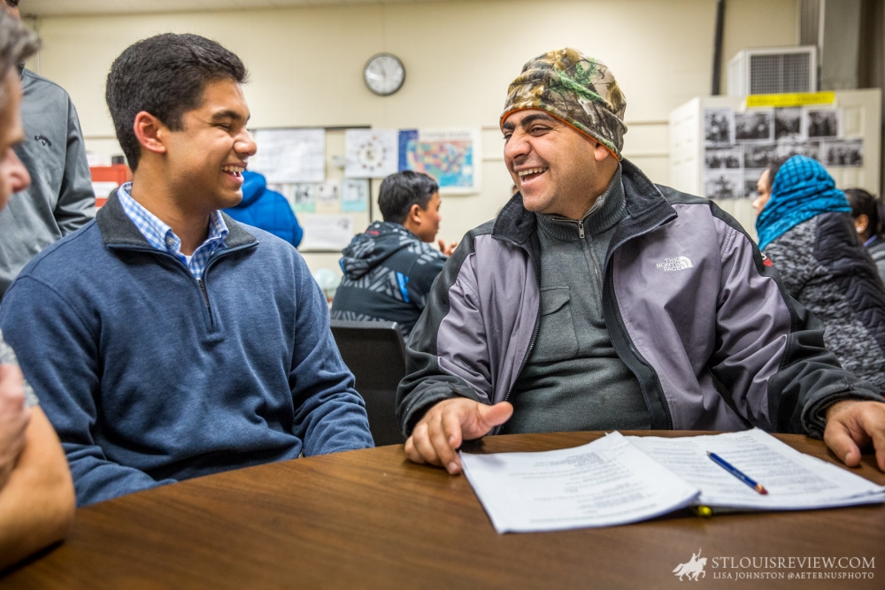 Priory student Sohan Kancherla, left, founded Bridges to America to raise awareness and assist refugees and immigrants assimilating into U.S. society. He helped teach a citizenship class at the International Institute and talked with former student Firas Kazlee who immigrated to St. Louis from Mosul, Iraq. “I just used Google to pick a place in the U.S. that looked nice,” Kazlee said, explaining how he came to St. Louis.