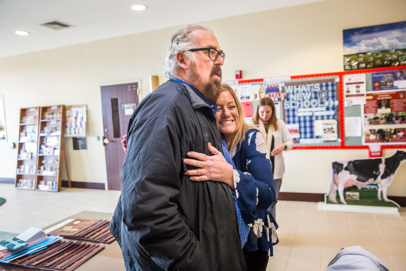 Mark Sienkiewicz, who survived a heart attack he had while attending an event at St. Simon the Apostle Parish, hugged Denise Buehler, one of the teachers who revived him with an AED (automated external defibrillator). Sienkiewicz’s doctor told him that if there hadn’t been an AED present, he probably would not have survived.