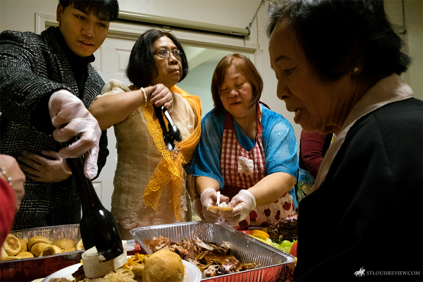 Parishioners Kevin Eulalia, left, Fely Eulalia and Merlinda Eulalia served Filipino delicacies after a Simbang Gabi Mass Dec. 18. Simbang Gabi is a novena of Masses honoring Mary. The tradition of Simbang Gabi traces back to the arrival of Spanish missionaries in the Philippines about 500 years ago. At the time, they had a tradition of celebrating pre-Christmas novena Masses in honor of the Annunciation.