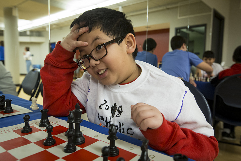 Raiden Nguyen of St. Frances Cabrini Academy played chess Jan. 27 at the Billiken Teacher Corps’ Catholic School Olympics at St. Louis University. Members of the Billiken Teacher Corps brought students from eight schools to participate in various events to open Catholic Schools Week.