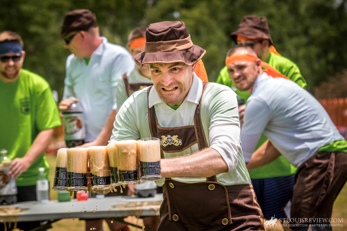Father Timothy Foy raced with six mugs of root beer across the course as he tried not to spill them during the German Games at St. John the Baptist ‘Gildehaus’ Parish on June 23.
