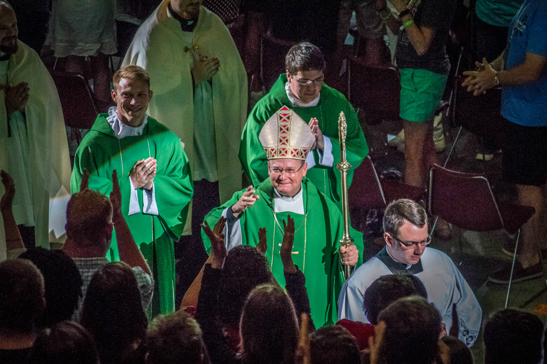 Archbishop Peter Wells, papal nuncio to South Africa, blesses the crowd during the recessional at Mass on Sunday, July 15 at Steubenville STL Mid-America. Invited by his nieces, the archbishop said he felt "reinvigorated" at his first-ever Steubenville conference.
