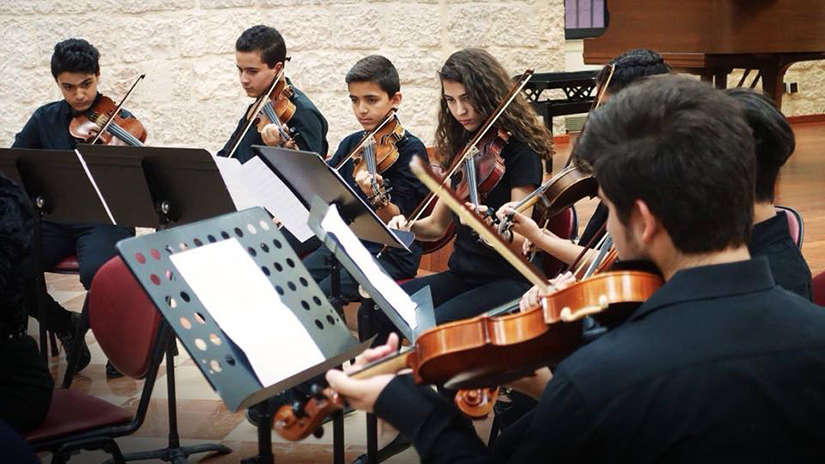 Members of the Franciscan-run Magnificat Institute Jerusalem perform in an undated photo. The institute, which opened in 1995, offers young people serious music education and study, regardless of religious background.