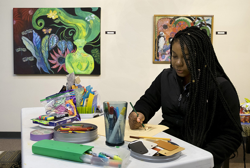 Nadia Sharif, a senior at Hazelwood West High School, sketched during an evening of “art storming” at Good Shepherd Arts Center in Ferguson. The “art storming” was a way to come up with artistic ideas for a show set for August at multiple venues in and around Ferguson.