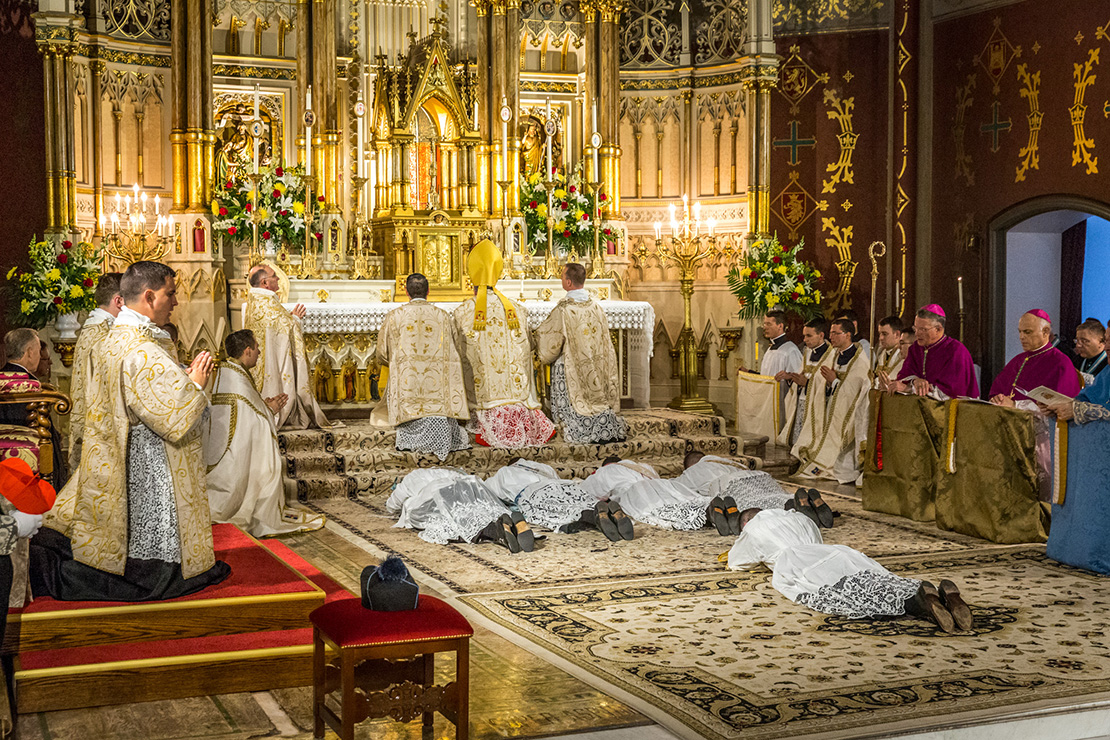 Cardinal Raymond L. Burke ordained Canons Peter Heidenreich, Benjamin Norman, Matthew Weaver and Luke Zignego to the priesthood for the Institute of Christ the King Sovereign Priest Aug. 2 at the Oratory of Saint Francis de Sales. The men lay prostrate on the floor during the Litany of Saints. 