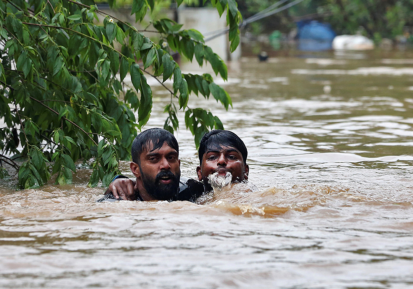 Rescuers saved a man from drowning Aug. 16 after the opening of a dam following heavy rains on the outskirts of Cochin, India. The Catholic Church has joined relief efforts as unprecedented floods and landslides continue to wreak havoc in India’s Kerala state, killing more than 350 people.