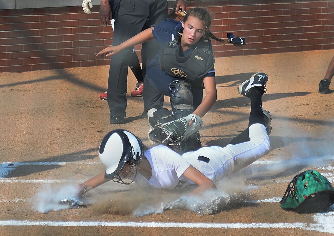 Samantha Foppe of Notre Dame tagged out Emma Heskett of Lutheran South in the second inning at Lutheran High School South on Aug. 27 in Kirkwood.