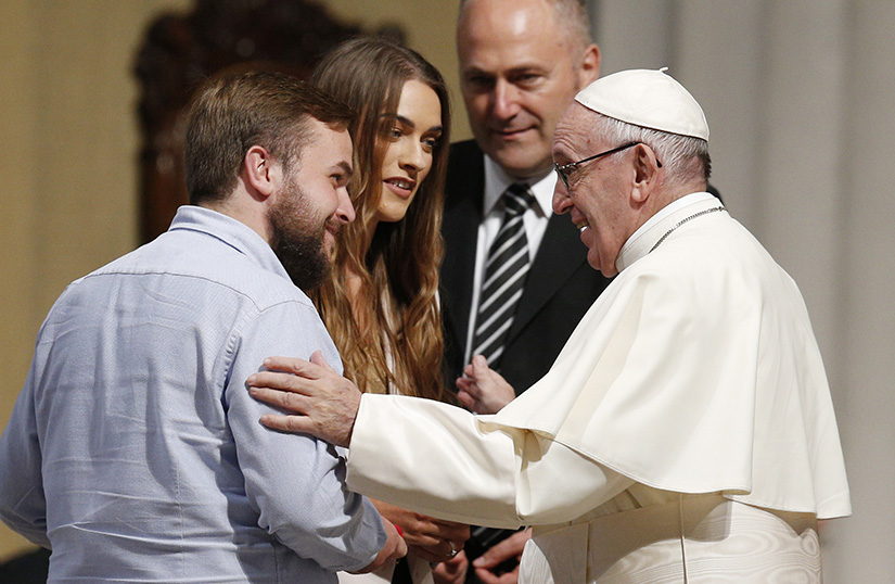 Pope Francis greeted a recently married couple at St. Mary’s Pro-Cathedral in Dublin Aug. 25.