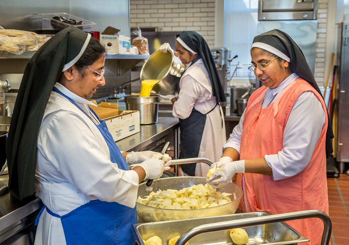 From left, Sister Assumpta Kurisunkal, Sister Rufina “Ruby” Devassy Kappithanparambil and Sister Lissy Ouseph Vazhakkoottathil prepared food in the Kenrick-Glennon Seminary kitchen on Sept. 13. The Sisters of the Congregation of the Carmelite Religious, from Trivandrum in the Indian state of Kerala, take care of Kenrick-Glennon seminarians by praying with them and cooking meals.