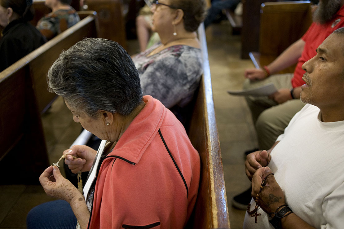 Worshippers prayed the Rosary during a prayer service Sept. 7 at Dolores Mission Church in Los Angeles. Pope Francis asked Catholics to pray the Rosary each day in October, seeking Mary’s intercession in protecting the Church and to make the Church more aware of her sins, errors and abuses.