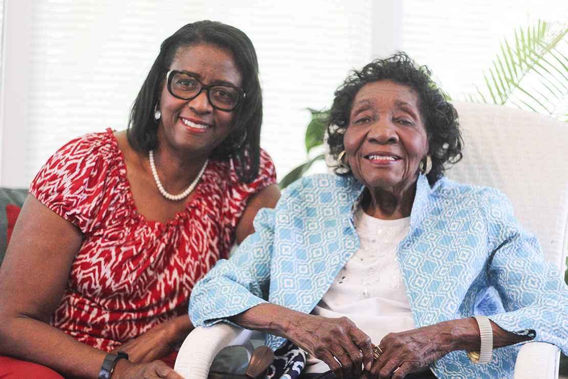 Vashti Jackson Woodson, right, sat with her daughter Veronica Ramseur July 26 at the home they share in Columbia, S.C. Woodson, who attends St. Martin de Porres Church with her family, turned 100 Aug. 25.