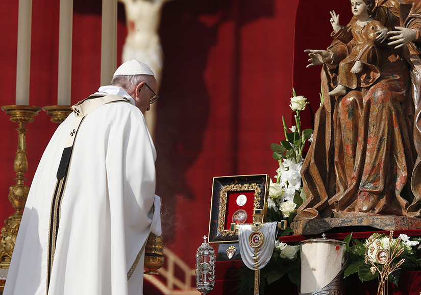 Pope Francis venerated relics as he celebrated the canonization Mass for seven new saints in St. Peter’s Square at the Vatican Oct. 14.