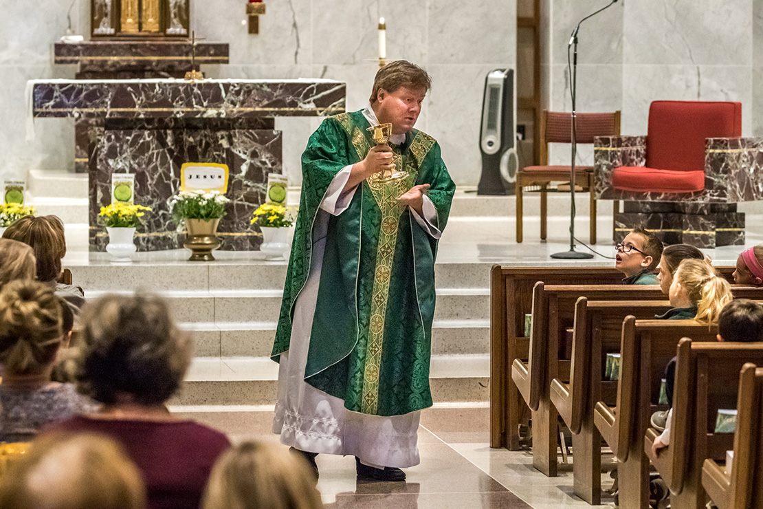 Father Edward Stanger remembered his friend Father Tim Bannes on the second anniversary of Father Bannes’ death on Oct. 26. Father Stanger wore Father Bannes’ chasuble and used his chalice for Mass at Holy Infant Parish on Oct. 26. He spoke to the school children in the homily about Father Bannes and the significance of using his chalice.