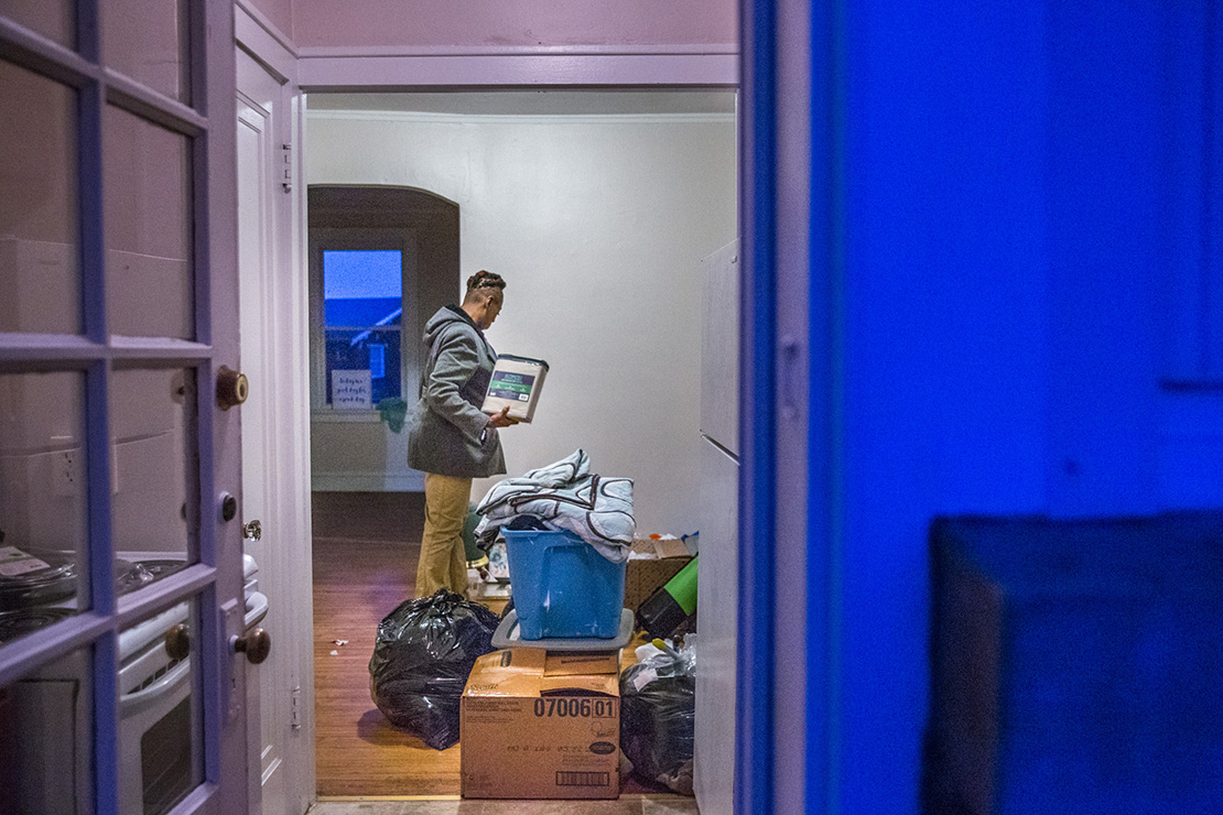 Tracy Stanton unloaded boxes and bags of her possesions as she was moving to her own apartment in south St. Louis from a transitional housing unit operated by the Center for Women in Transition.