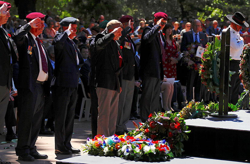 Representatives of ex-service organizations saluted after laying wreaths at a memorial service at the ANZAC War Memorial to mark the centenary of the armistice ending World War I, in Sydney, Nov. 11.
