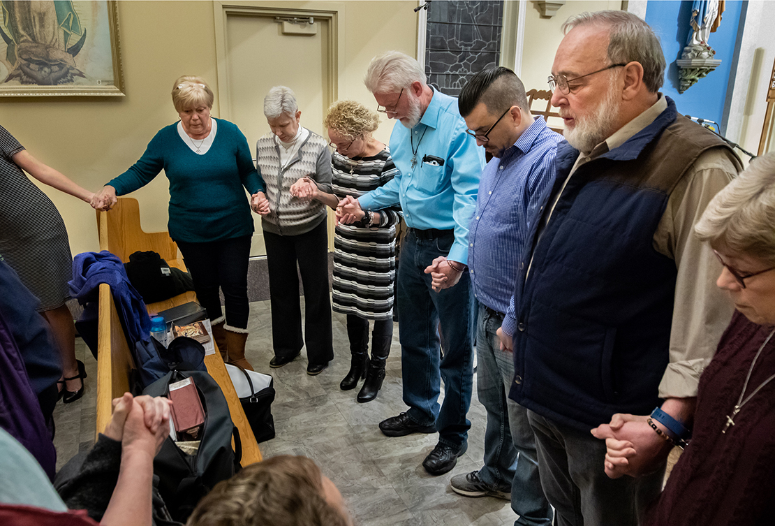 Deacon Ken Henning, right, led the choir in prayer before Mass for Jamie Schmidt at St. Anthony of Padua Church in High Ridge on Tuesday, Nov. 20, 2018. Schmidt was killed while shopping at the Catholic Supply store in west St. Louis County.