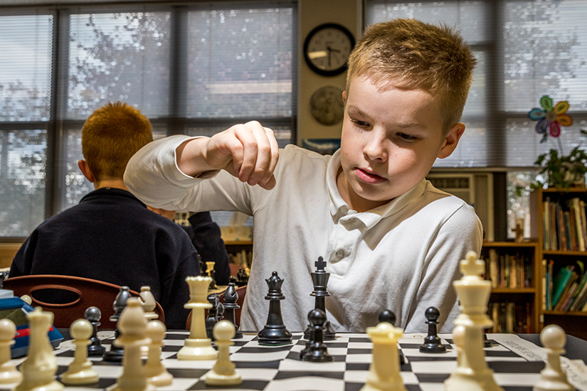 Jack Friedman, a fifth-grader at St. Peter School in Kirkwood, made his move during an after school tournament on Nov. 14. Instructors from the Chess Club of St. Louis offer weekly lessons to students, many of whom play in the CYC chess league.