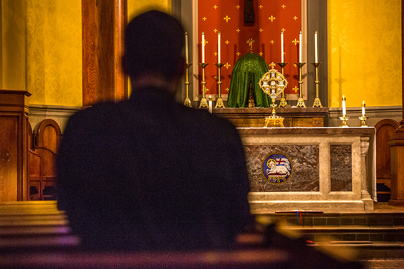 Michael Trummer, a Theology III student from Springfield, Ill.., prayed in the chapel at Kenrick-Glennon Seminary during eucharistic adoration on Sept. 10.