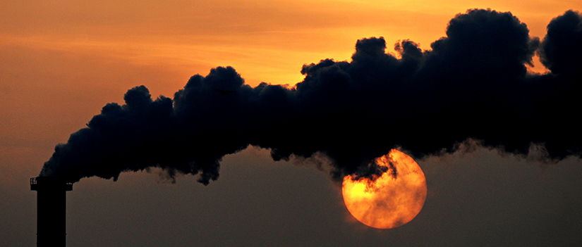 Smoke billows from a plant in 2015 at sunset in Wismar, Germany. 