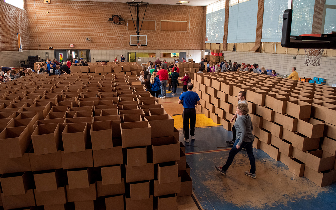 Empty cardboard boxes awaited filling by volunteers with items for Christmas baskets being distributed to people helped by Father Bob’s Outreach. The ministry assists people in need in north St. Louis, primarily in the areas served by St. Augustine and St. Elizabeth Mother of John the Baptist parishes. During the Dec. 1 work day, the group packed 3,000 Christmas baskets with non-perishable items.