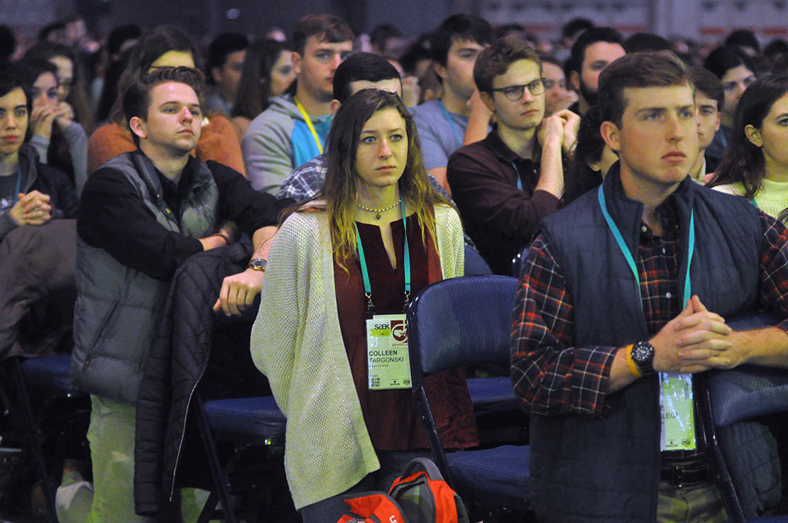 Young people knelt in prayer Jan. 6 at Mass at the SEEK conference that drew 17,000 mainly college students from across the country to the Indiana Convention Center in Indianapolis. The conference is a biennial event sponsored by the Fellowship of Catholic University Students.