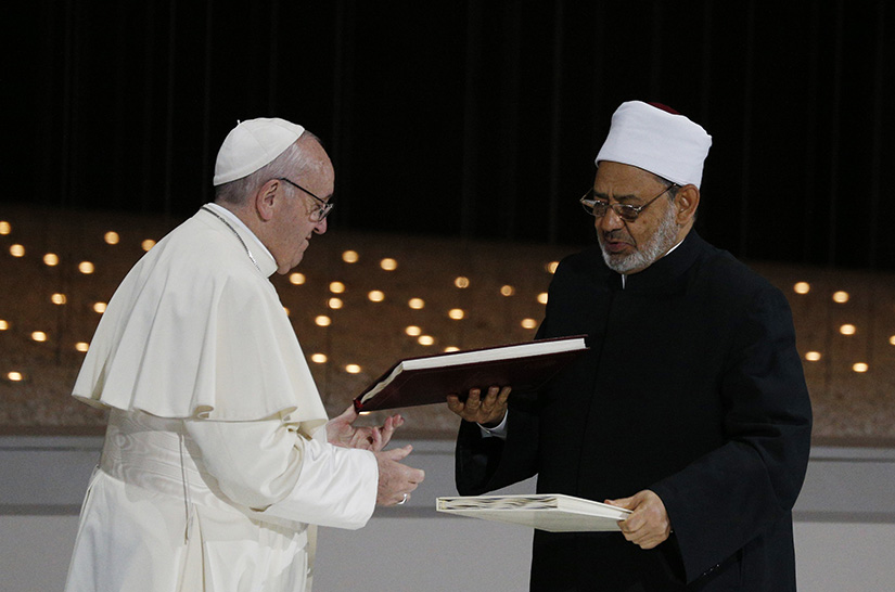Pope Francis and Sheik Ahmad el-Tayeb, grand imam of Egypt's al-Azhar mosque and university, exchanged documents during an interreligious meeting at the Founder's Memorial in Abu Dhabi, United Arab Emirates, Feb. 4, 2019. 