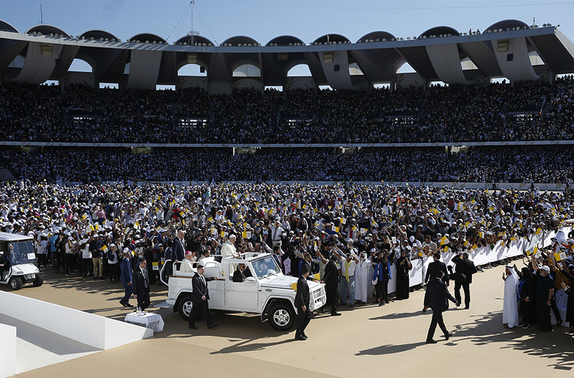 Pope Francis greeted the crowd as he arrived to celebrate Mass at Zayed Sports City Stadium in Abu Dhabi, United Arab Emirates, Feb. 5.
