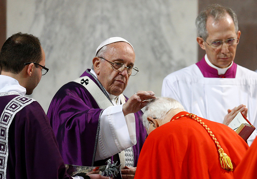 Pope Francis places ashes on the head of a cardinal during Ash Wednesday Mass at Santa Sabina Basilica in Rome March 6, 2019.