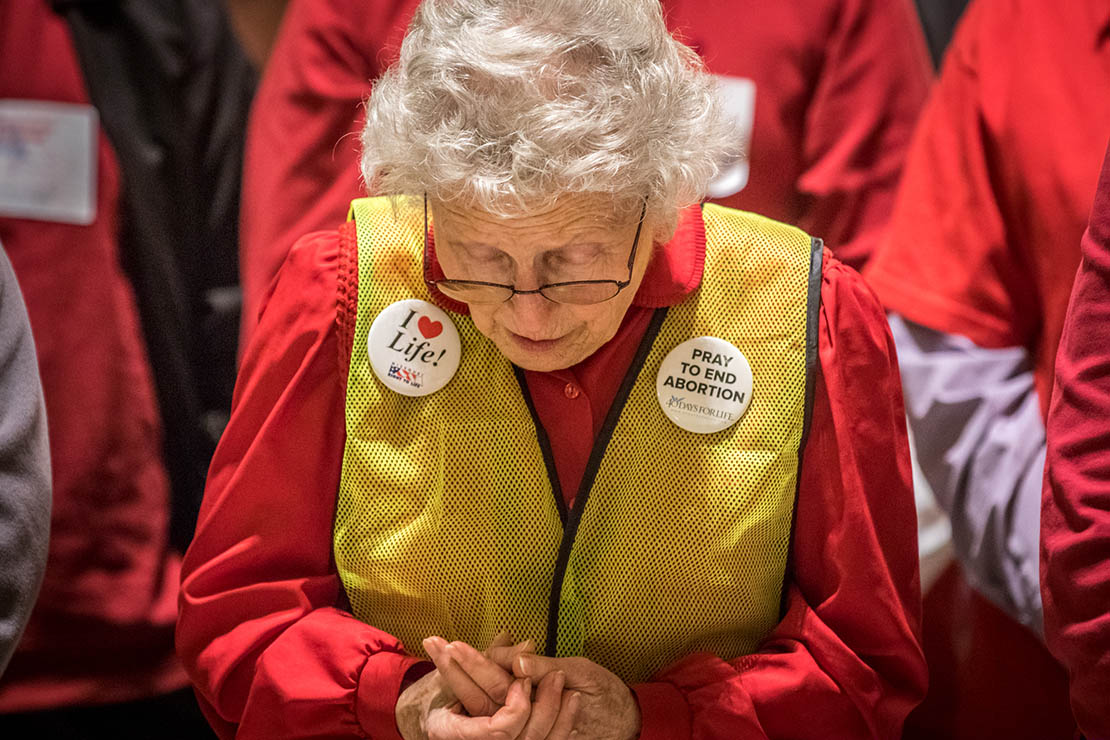 Sandie Colbert from Kansas City prayed during pro-life lobby day March 12 in Jefferson City. More than 300 people attended the lobby day.