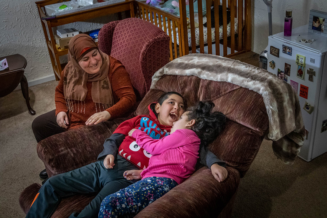 Kifah Abdallah watched as Nabeel and his sister Carole rocked on a chair together. “He is very protective of her,” she said. Through a connection with St. Rose Philippine Duchesne Church in Florissant and SSM Cardinal Glennon Children’s Hospital, Nabeel’s parents, Tariq Alkfoof and his wife Hibah Alkufouf, were able to come to St. Louis from Jordan for better medical care for their children.