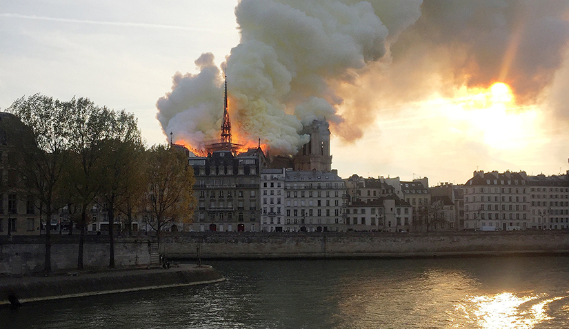 Flames and smoke billow from the Notre Dame Cathedral after a fire broke out in Paris April 15. Officials are unsure of the cause of the fire, but suggested it could be linked to renovation work. 