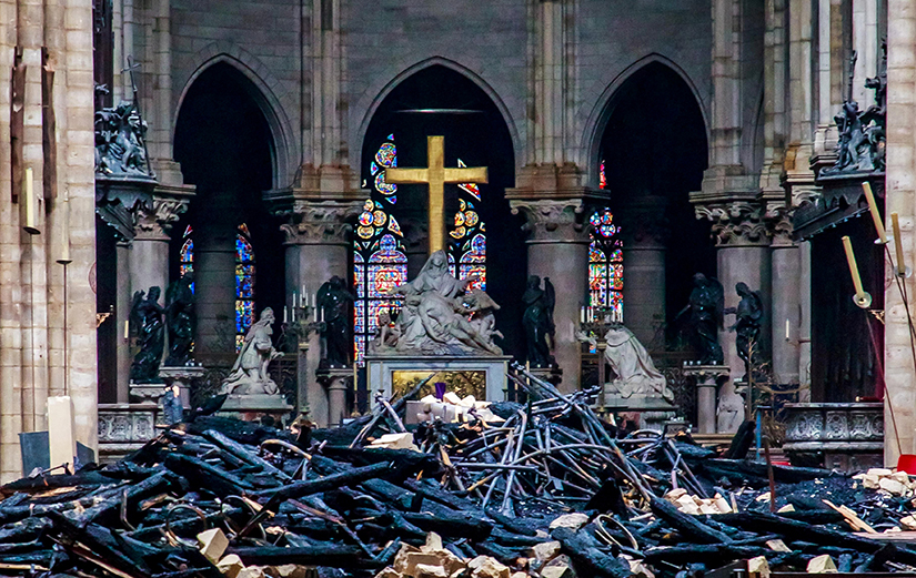 Debris surrounded a depiction of the Pieta by Nicolas Coustou in Notre Dame Cathedral April 16, a day after a major fire destroyed much of the church’s wooden structure. Officials were investigating the cause, but suspected it was linked to renovation work.