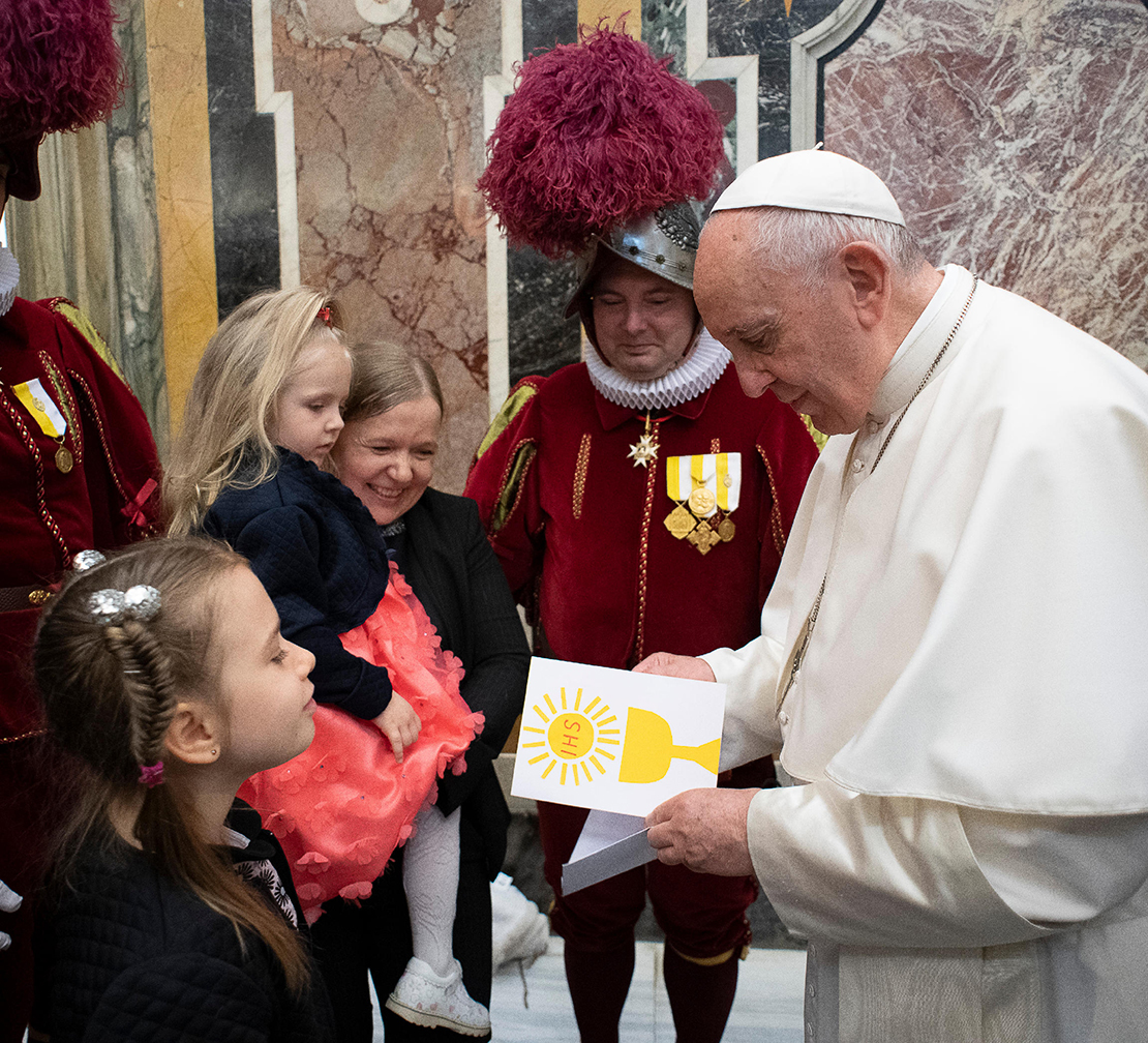 Pope Francis read a card from a child as he welcomed 23 new recruits to the Swiss Guard and family members May 4 at the Vatican. The pope encouraged the new recruits to be holy and a source of encouragement and inspiration to others during their service. The values they learn by living in barracks, such as understanding diversity, dialogue and loyalty will serve them well in life, he said.