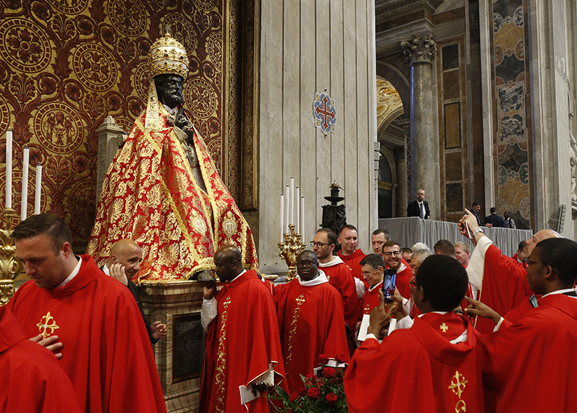 Clerics reverenced the statue of St. Peter after attending Pope Francis’ celebration of Mass marking the feast of Sts. Peter and Paul in St. Peter’s Basilica June 29. After the Mass, the pope presented palliums to new archbishops from around the world.