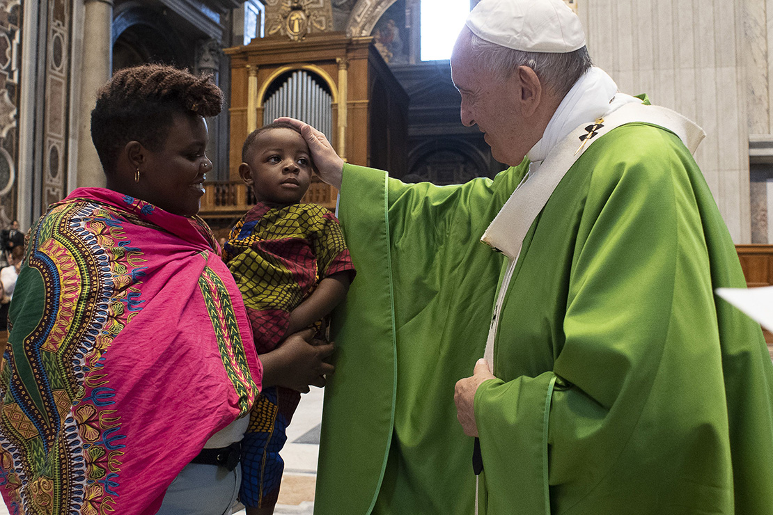 Pope Francis blessed a woman and child at Mass July 8 in St. Peter’s Basilica at the Vatican, commemorating the sixth anniversary of his visit to the southern Mediterranean island of Lampedusa.