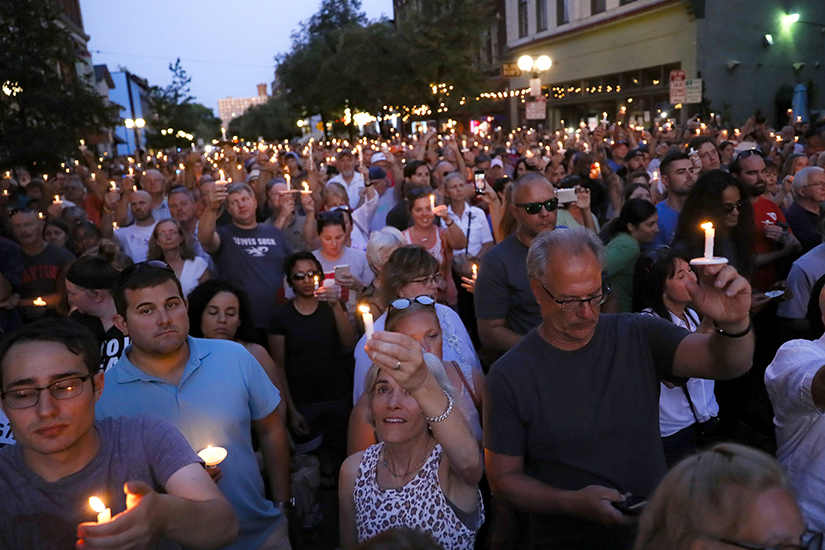 Mourners gathered Aug. 4 for a vigil at the scene of a mass shooting in Dayton, Ohio. Multiple people in Ohio were killed in the second mass shooting in the U.S. in less than 24 hours.