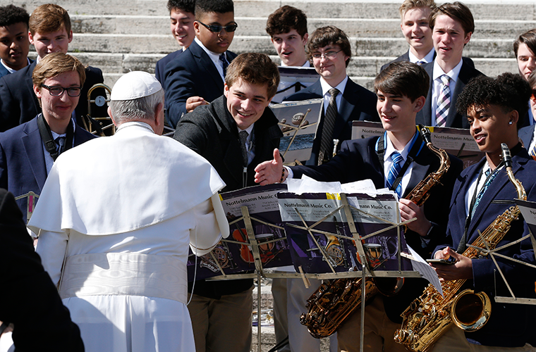 Pope Francis spontaneously greeted student musicians from St. Louis University High School at his general audience March 14 in St. Peter’s Square at the Vatican. From left to right, the SLUH students are: Sam Pottinger, senior; Emmanuel Parker, senior; Bobby Rizzo, freshman; Ezana Ephrem, senior. The pope listened to the band play “Oh Sacred Head Now Wounded.” Some SLUH students were in Rome for spring break a part of the school’s bicentennial celebration.