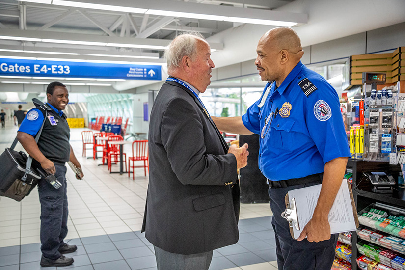 Deacon James Martin talked with Carolyn Cunningham as he walked his rounds as chaplain at St. Louis Lambert International Airport Aug. 26. Deacon Martin is one of several permanent deacons who serve in the archdiocesan Airport Chaplaincy’s ministry of presence. Chaplains take shifts checking on and responding to travelers and employees in need of comfort or spiritual uplift.