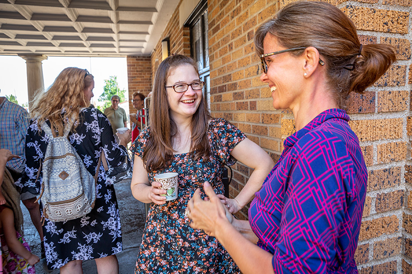 Bridget Perron talked with Elizabeth Wildman as parishioners gathered after Mass for fellowship and Breviary Coffee at Epiphany of Our Lord in St. Louis on Aug. 4. The parish provides coffee and a place for fellowship after 10:30 a.m. Mass on Sundays.