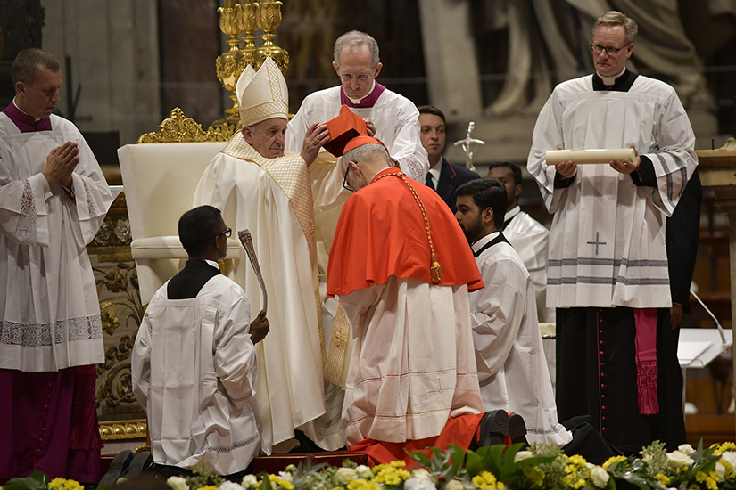 Pope Francis placed a red biretta on new Canadian Cardinal Michael Czerny during a consistory for the creation of 13 new cardinals in St. Peter’s Basilica at the Vatican Oct. 5. Cardinal Czerny, undersecretary of the Section for Migrants and Refugees at the Dicastery for Promoting Integral Human Development, was ordained a bishop the day before he was elevated to cardinal.