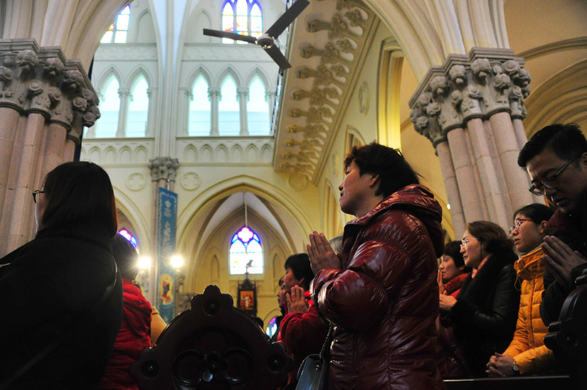 People prayed during Mass at St. Ignatius Cathedral in Shanghai in 2017.