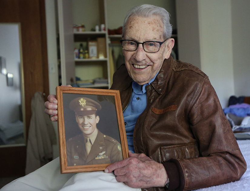 Don Stoliel of Sacred Heart Parish in Robbinsdale, Minn., held a picture of himself that was taken near the end of his tour of duty in World War II as a B-17 bomber pilot. He carried a relic of St. Therese of Lisieux in the cockpit during all of his 31 missions and credits the saint for his survival.
