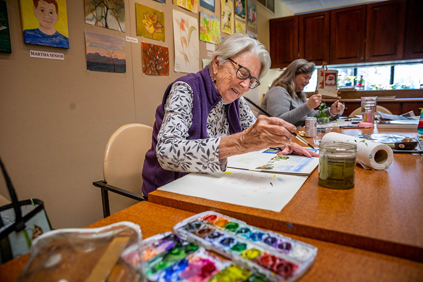 Berkeley Gunther painted a water color image of the Jewel House during art class at The Gatesworth in University City on Nov. 5.