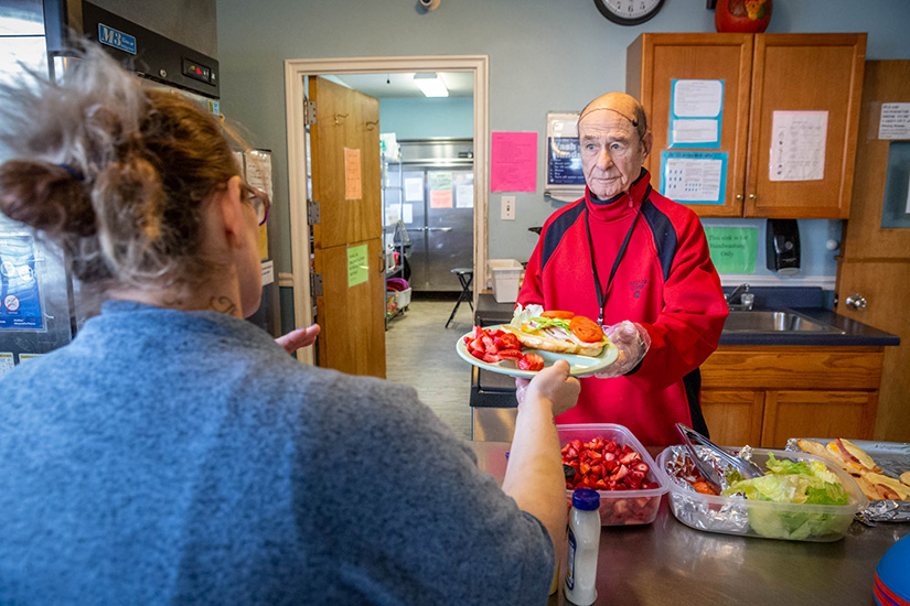 Don Nary served lunch to residents at Our Lady’s Inn in St. Louis. He and his wife, Alverne (“Al”) have volunteered at the maternity home for a decade.