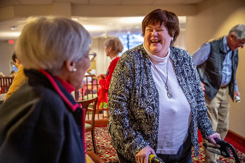 Nancy Bitter has found the continuum of care aspect of Cardinal Ritter Senior Services to be a benefit to her — after surgery she moved to the nursing home to assisted living to independent living, all on the campus in Shrewsbury. Bitter chatted with Nancy Sterr after a Veterans Day commemoration at Our Lady of Life.