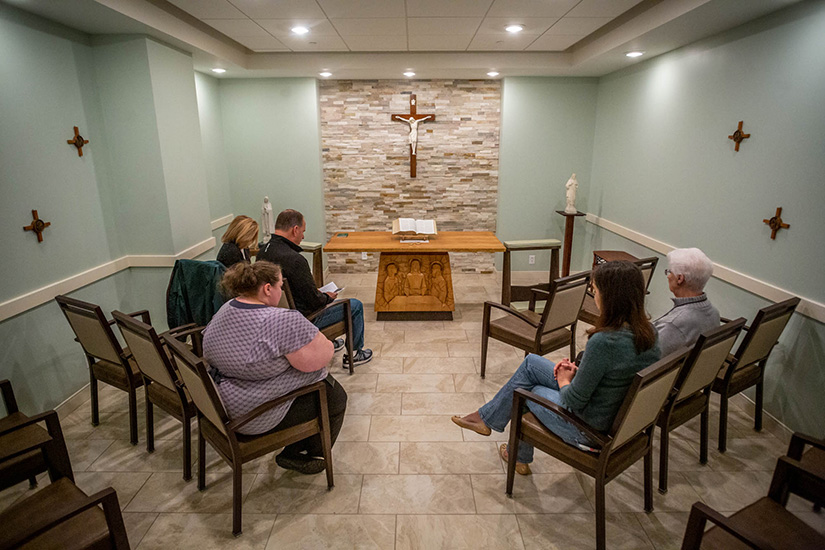 Mike Heck spearheaded an effort to build a chapel at St. Patrick Center. He led the Rosary and distributed the Eucharist during a communion service at St. Patrick Center Downtown on Nov. 7.