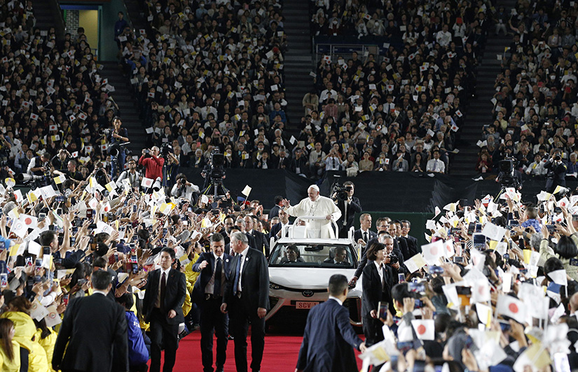 Pope Francis greeted the crowd before celebrating Mass in Tokyo Dome in Tokyo Nov. 25.