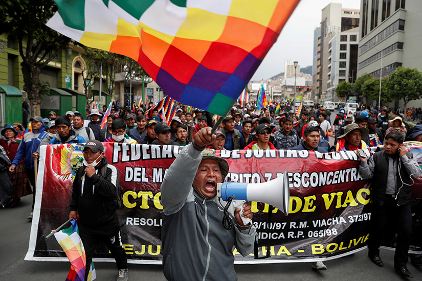 Supporters of former Bolivian President Evo Morales protested in La Paz Nov. 14. Bolivian bishops are organizing talks between political factions as protests against the nation’s new government become increasingly deadly.