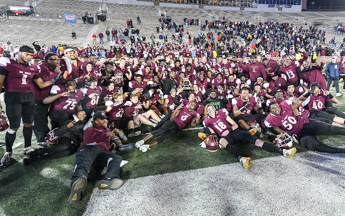 De Smet players and coaches posed after winning the Class 6 State championship football game against Joplin on Nov. 30, at Faurot Field in Columbia, Mo. 